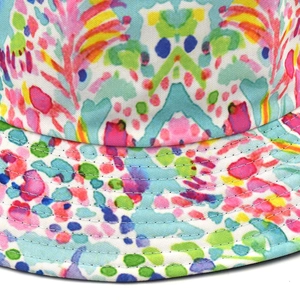 Detail of colorful abstract floral print on canvas bucket hat with reinforced stitching