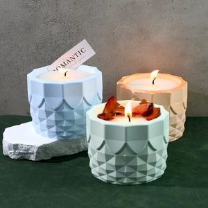 DIY geometric cylinder candle holders and resin molds in pastel colors with floral accents