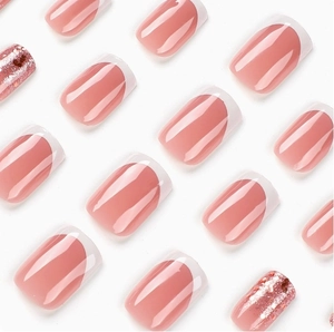 French tip press-on nails in nude pink with rose gold glitter and square shape