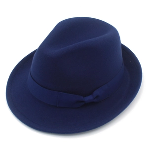 Detail shot of navy blue wool felt fedora with a matching grosgrain ribbon bow