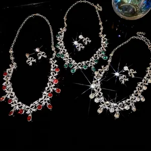 Elegant crystal teardrop necklace and earring set with bow design in three colors