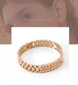 Macro shot of rose gold stainless steel watch-link bracelet with a secure fold-over clasp