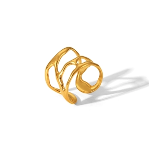 Macro shot of minimalist gold plated stainless steel open ring with hollowed irregular design