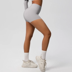Side view of high-waisted light grey yoga shorts with tummy control and lifting effect