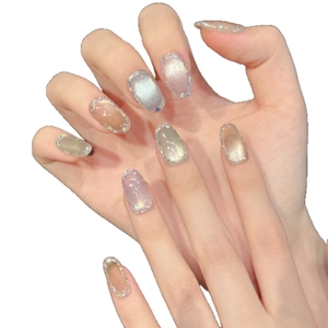 Sparkly cat-eye press-on nails with silver glitter and colorful gemstone effects