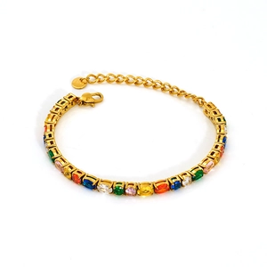 Detail of colorful oval zirconia stones set on a gold stainless steel tennis bracelet