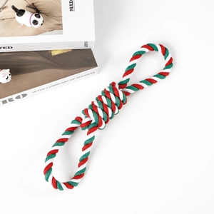 Detail view of 8-shaped Christmas dog rope toy in festive red, white, and green colors