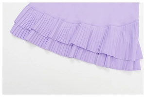 Detailed close-up of lavender pleated hem with dual-layer structure and premium stitching