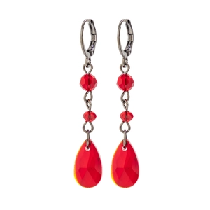 Detail of red faceted teardrop earrings with gunmetal chain and vintage crystal beads