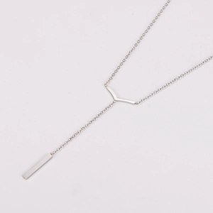 Detail of silver Y-shaped stainless steel necklace with geometric vertical bar pendant