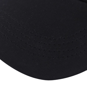 Detailed macro view of black washed cotton baseball cap brim with multi-row stitching detail