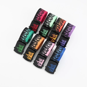Flat lay display of colorful flame pattern canvas belts with various vibrant fabric shades