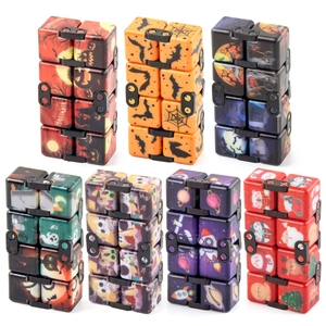 Infinity Cube fidget toy set featuring Halloween and Christmas holiday themed patterns
