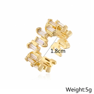 Detailed view of gold plated geometric open ring with micro inlaid white zircon stones