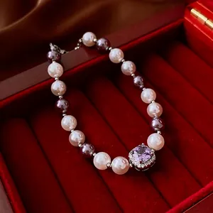 Vintage pearl bracelet with square purple zircon in a luxury red velvet jewelry box