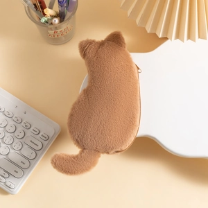 Detail showing the plush brown cat-shaped pencil case with fluffy tail and ears