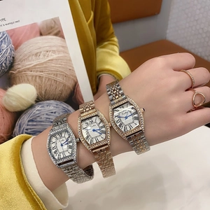 Detail of tonneau quartz watches with rhinestone bezels and roman numeral dials