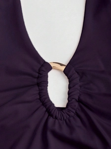 Slim fit deep purple halter crop top featuring a polished gold metal ring connector