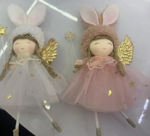 Detail of creative plush angel pendants with rabbit ears and golden wings for Christmas