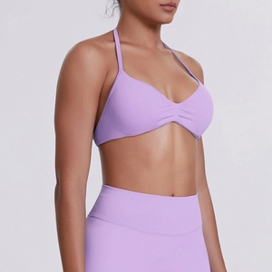 Macro view of the lavender purple sports bra featuring halter straps and gathered fabric detail