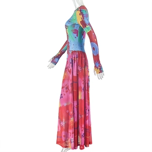 Detail of colorful abstract print on long-sleeved A-line dress with ankle-length hem