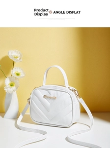 Close-up of white V-quilted small square bag with gold hardware and removable strap