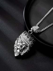 Close-up of silver lion head pendant with crown featuring sparkling crystal accents