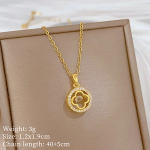 Detail of gold clover necklace with crystal inlay, including weight and size specifications