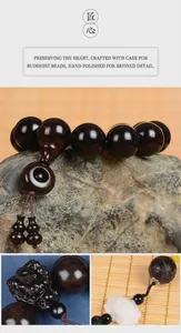 Macro view of Ebony wood beads with PiXiu carving and white lotus flower pendant