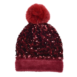 Detail of burgundy sequin knit hat with plush faux fur trim and fluffy pom-pom top