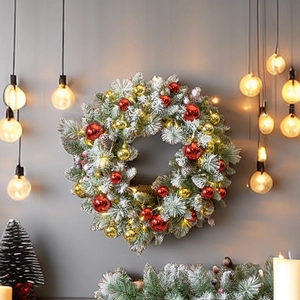 40cm pre-lit flocked Christmas wreath with red and gold ornaments on a grey wall