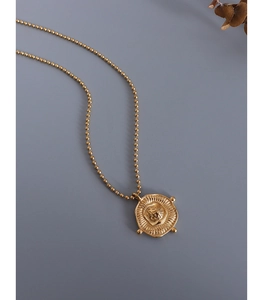 Detailed close-up of retro 18k gold plated irregular square coin pendant on a ball chain