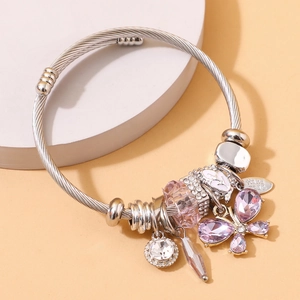 Silver stainless steel open bangle with pink crystal butterfly and handmade charm