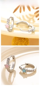Detail of pink and blue enamel star hoop earrings with sparkling cubic zirconia inlay