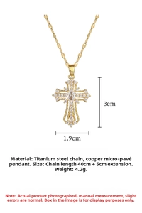 Detailed view of gold cross pendant with cubic zirconia inlay and sleek box chain
