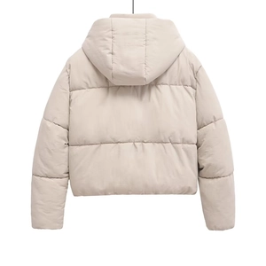 Rear view of women's beige quilted puffer jacket showing wide quilting and hooded design
