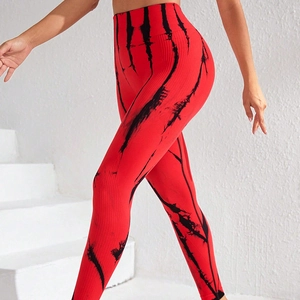 High-waisted red and black tie-dye seamless yoga leggings with ribbed texture