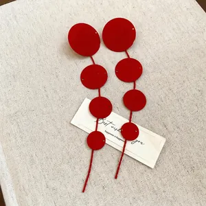 Chic multi-tier red disc tassel earrings with spiral texture for festive occasions