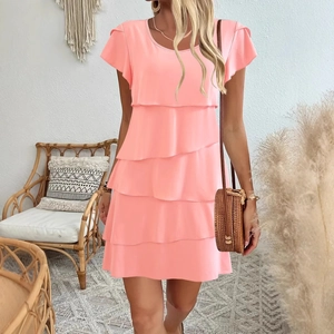 Pink ruffled tiered mini dress with butterfly sleeves and a loose bohemian fit