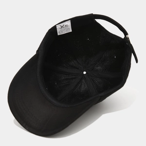 Detail view of the cotton baseball cap interior with moisture wicking band and wash labels