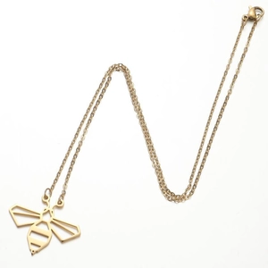 Detail of a gold bee pendant with geometric cutout design on a fine cross chain necklace