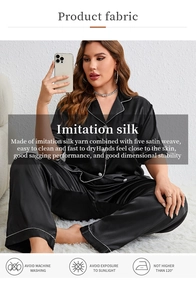 Detail of luxury satin pajama set featuring white contrast piping on premium black fabric
