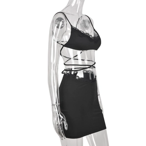 Detailed side view of black two-piece beach set featuring lace trim and lace-up details