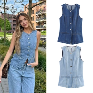 Detail view of denim vests in light and dark blue with buttons and flap pockets