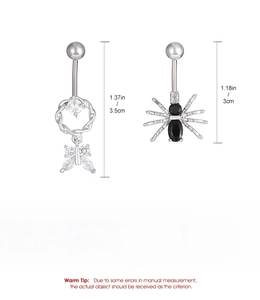 Detailed view of butterfly and spider belly rings with cubic zirconia and steel material