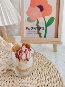 Detailed view of handmade strawberry chocolate cream scented candle in a glass cup