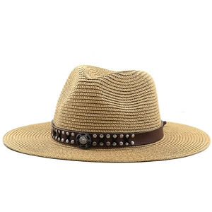 Straw cowboy hat with brown leather band and metallic studs on white background
