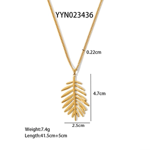 Detailed view of a gold leaf pendant necklace with dimensions 4.7cm x 2.5cm and chain specs