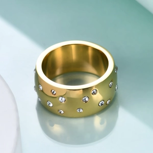 Minimalist 10mm gold stainless steel ring with scattered star-set cubic zirconia diamonds