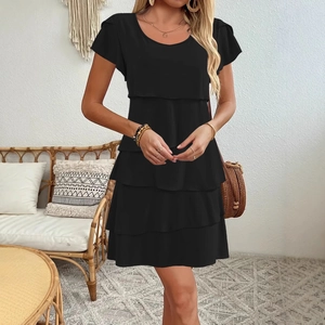Elegant black tiered mini dress with short sleeves and a round neck for a stylish summer look